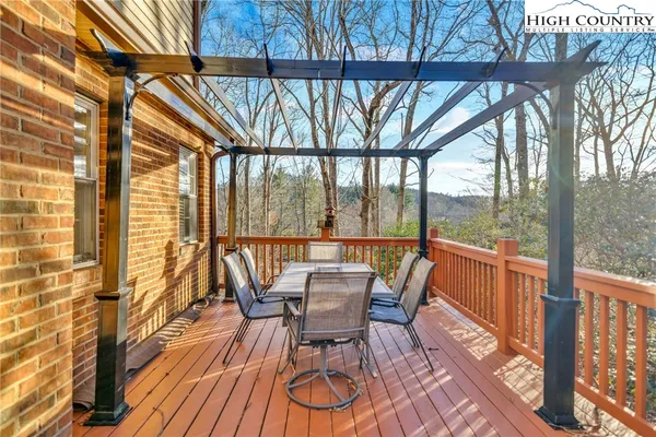a view of a two chairs in the balcony