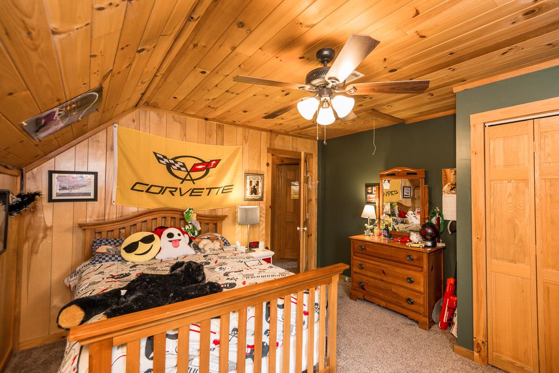 703 Beckwith Road Mount Juliet, TN 37122 - Photo 19 of 29 a bedroom with a bed and a table in it
