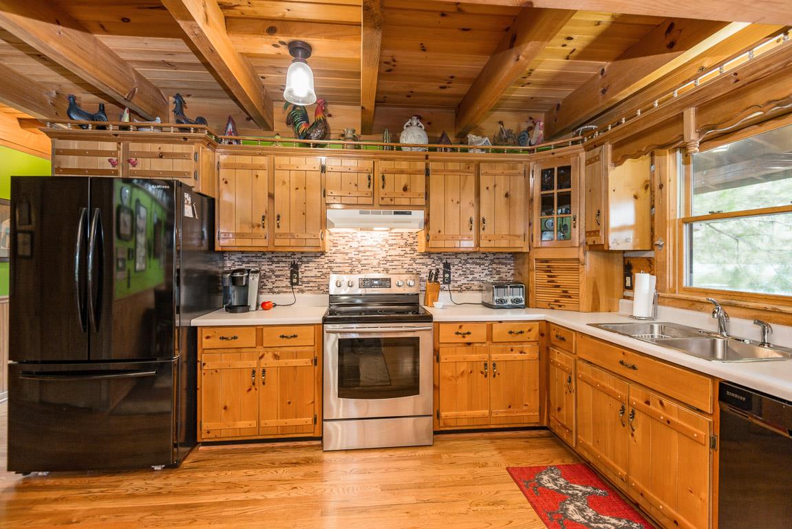 703 Beckwith Road Mount Juliet, TN 37122 - Photo 9 of 29 a kitchen with stainless steel appliances granite countertop a refrigerator and a sink