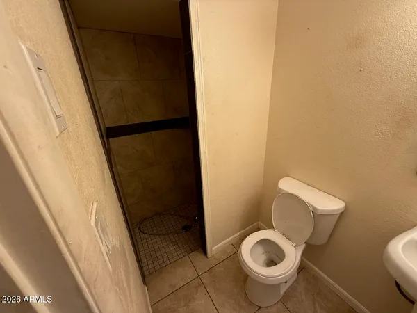a bathroom with a toilet and a sink