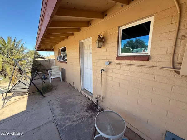 a view of a swimming pool with a patio