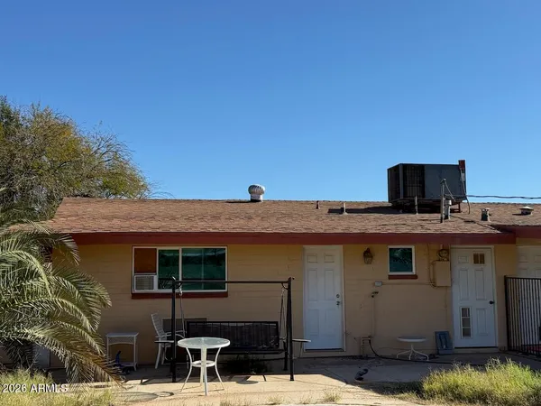 a view of a backyard of the house