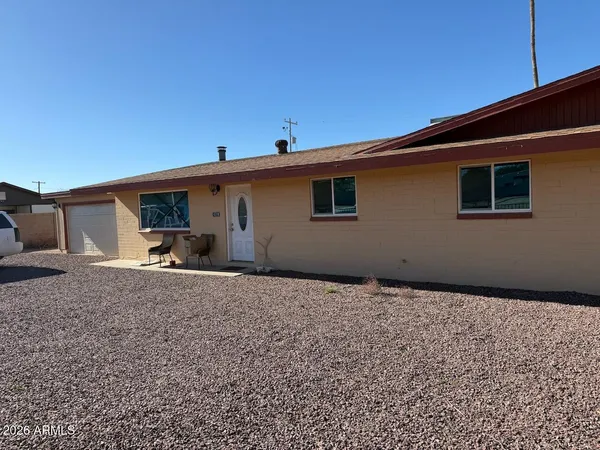 a house view with a backyard space
