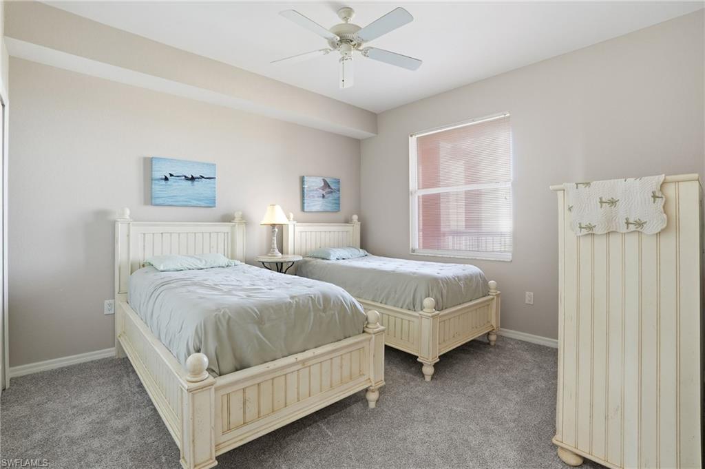 150 Lenell Road, Unit 503 Fort Myers Beach, FL 33931 - Photo 29 of 32 a bedroom with a bed and a table