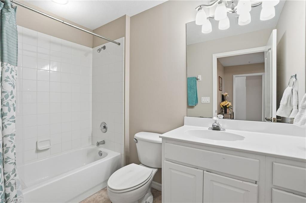 150 Lenell Road, Unit 503 Fort Myers Beach, FL 33931 - Photo 31 of 32 a bathroom with a sink a toilet and shower