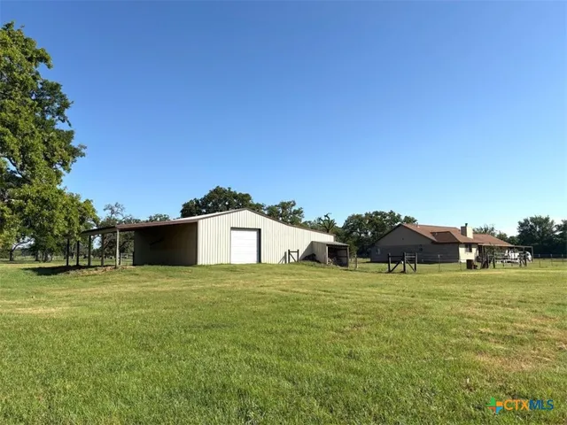 a view of a house with a big yard