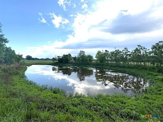 a view of a lake with a yard