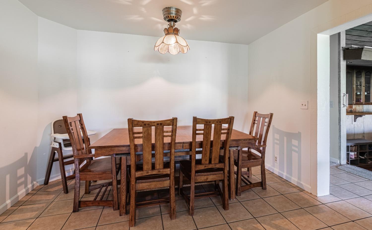 16993 Jennifer Court Madera, CA 93636 - Photo 12 of 55 a view of a dining room with furniture