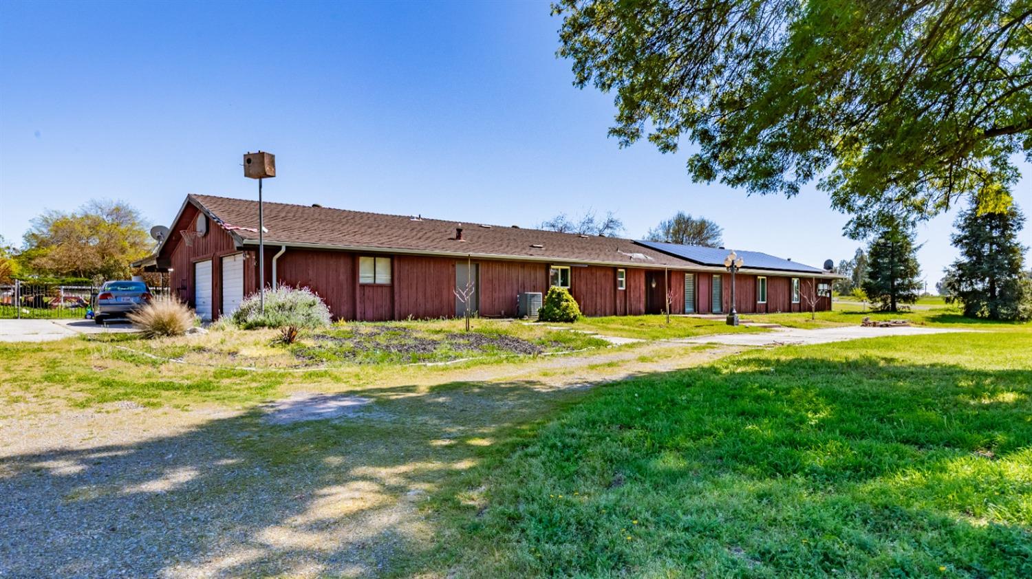 16993 Jennifer Court Madera, CA 93636 - Photo 2 of 55 a front view of a house with swimming pool having outdoor seating