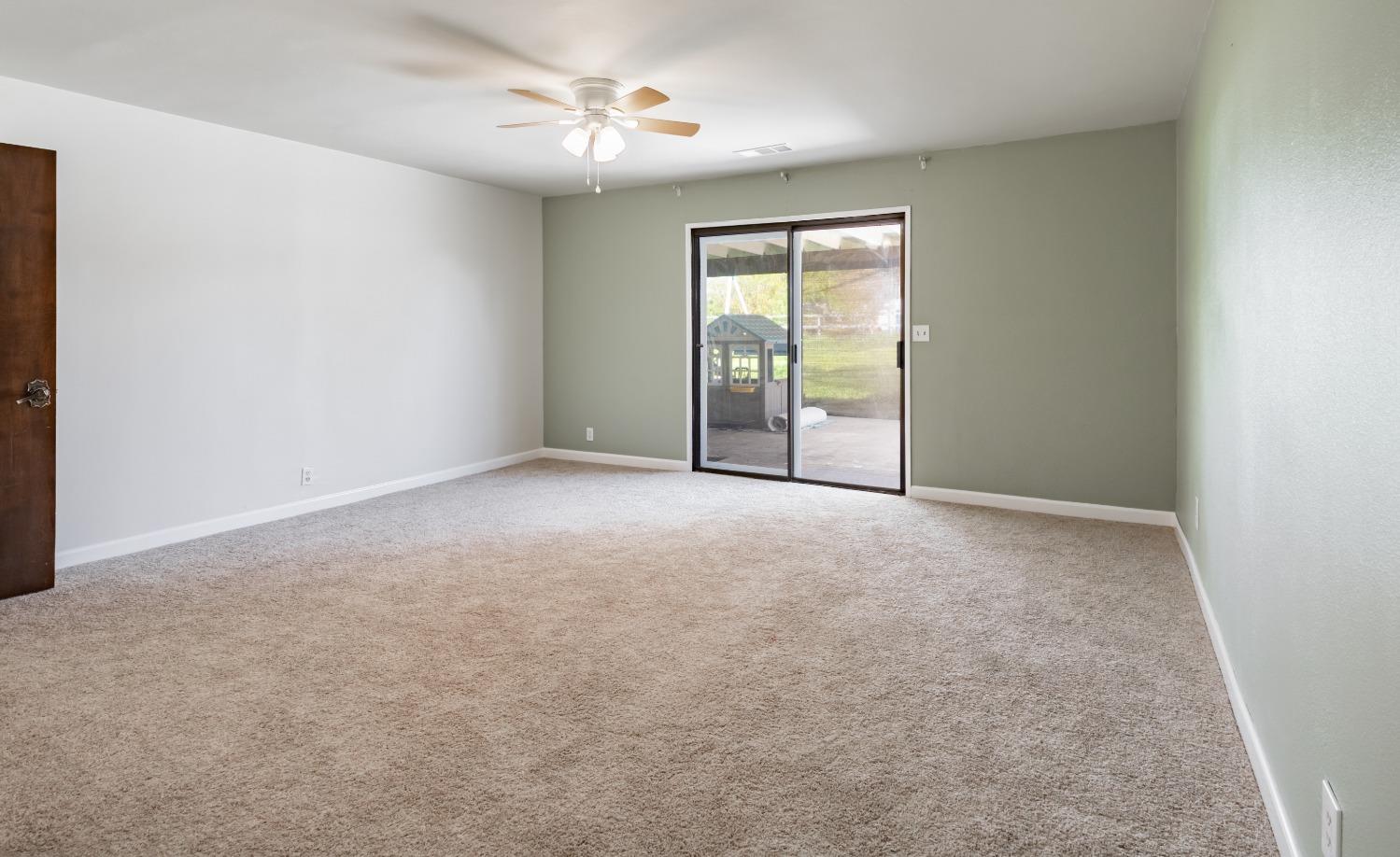 16993 Jennifer Court Madera, CA 93636 - Photo 27 of 55 a view of an empty room with a window
