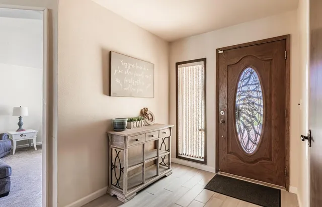 a living room with furniture and windows