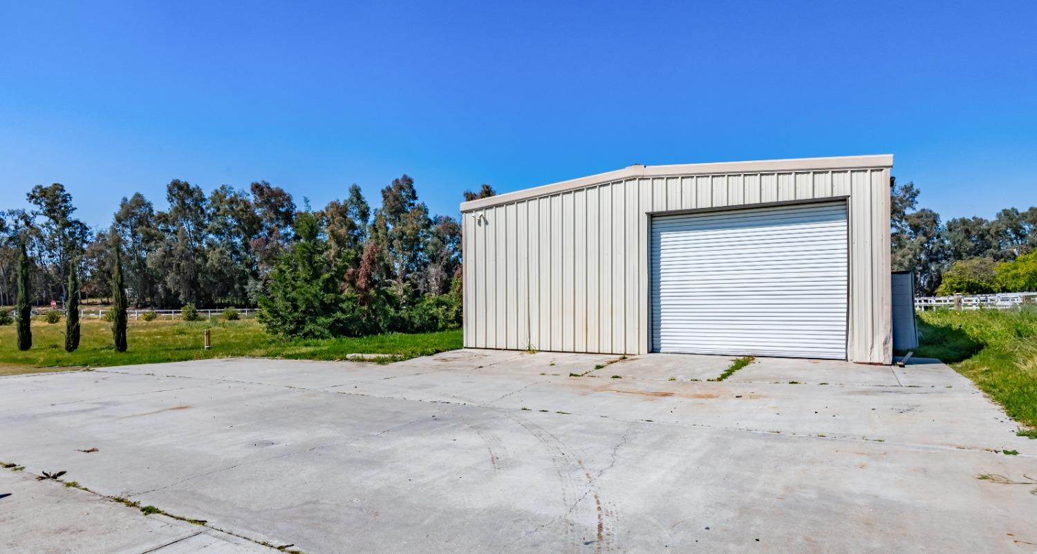 16993 Jennifer Court Madera, CA 93636 - Photo 34 of 55 a view of wooden house with a yard