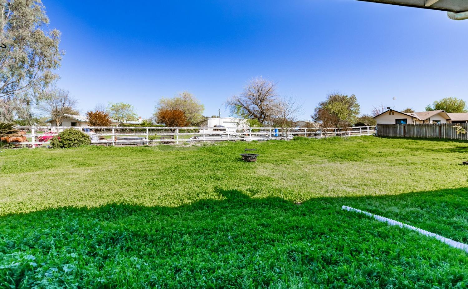 16993 Jennifer Court Madera, CA 93636 - Photo 35 of 55 a backyard of a house with table and chairs