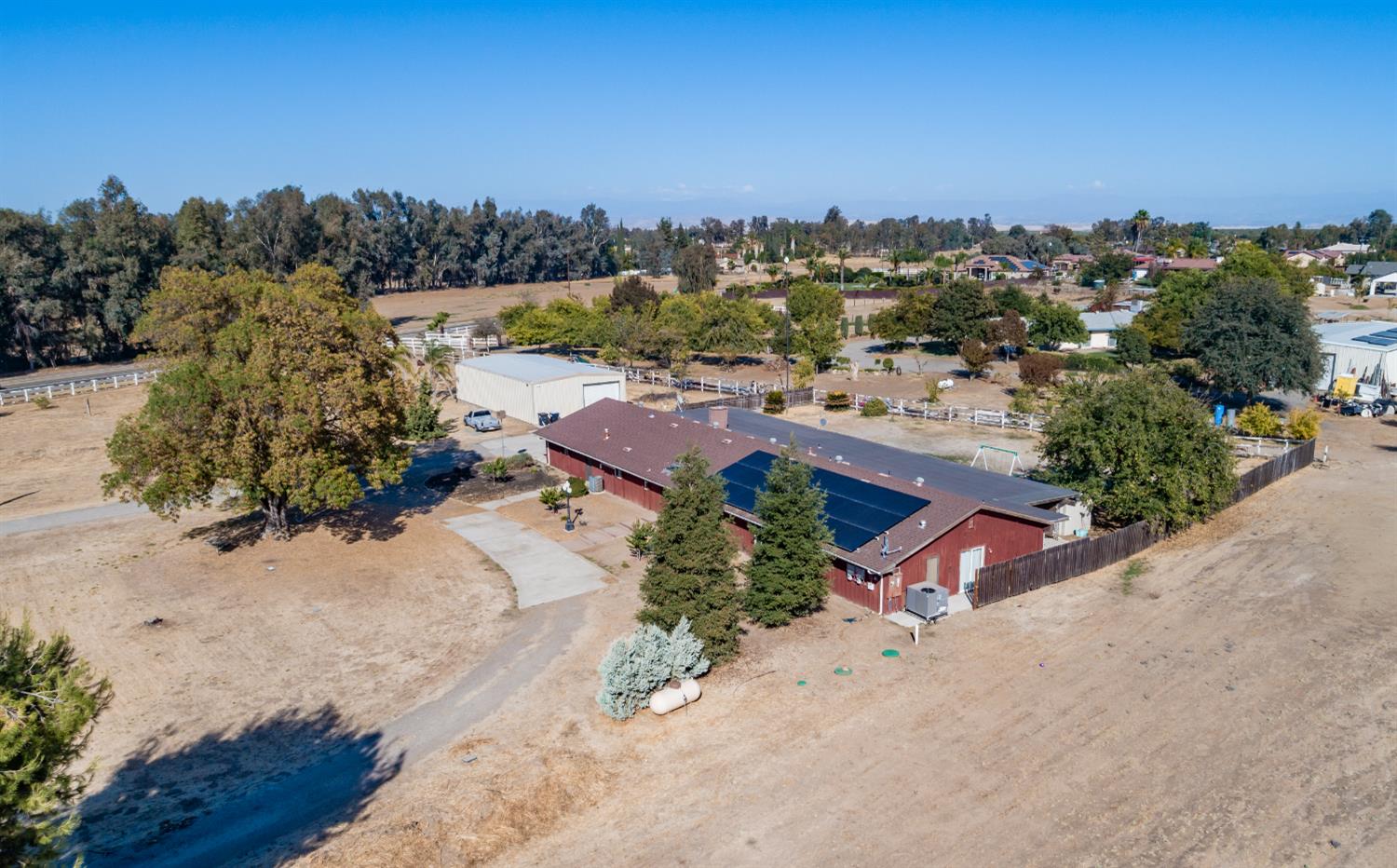 16993 Jennifer Court Madera, CA 93636 - Photo 49 of 55 an aerial view of a house with a lake view