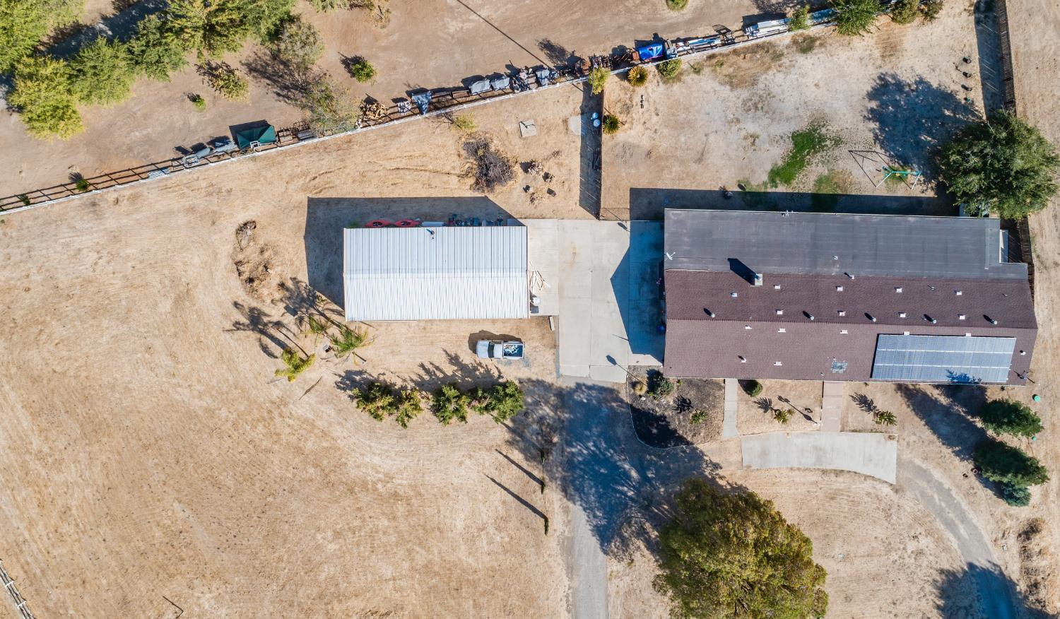 16993 Jennifer Court Madera, CA 93636 - Photo 53 of 55 an aerial view of a house with a yard
