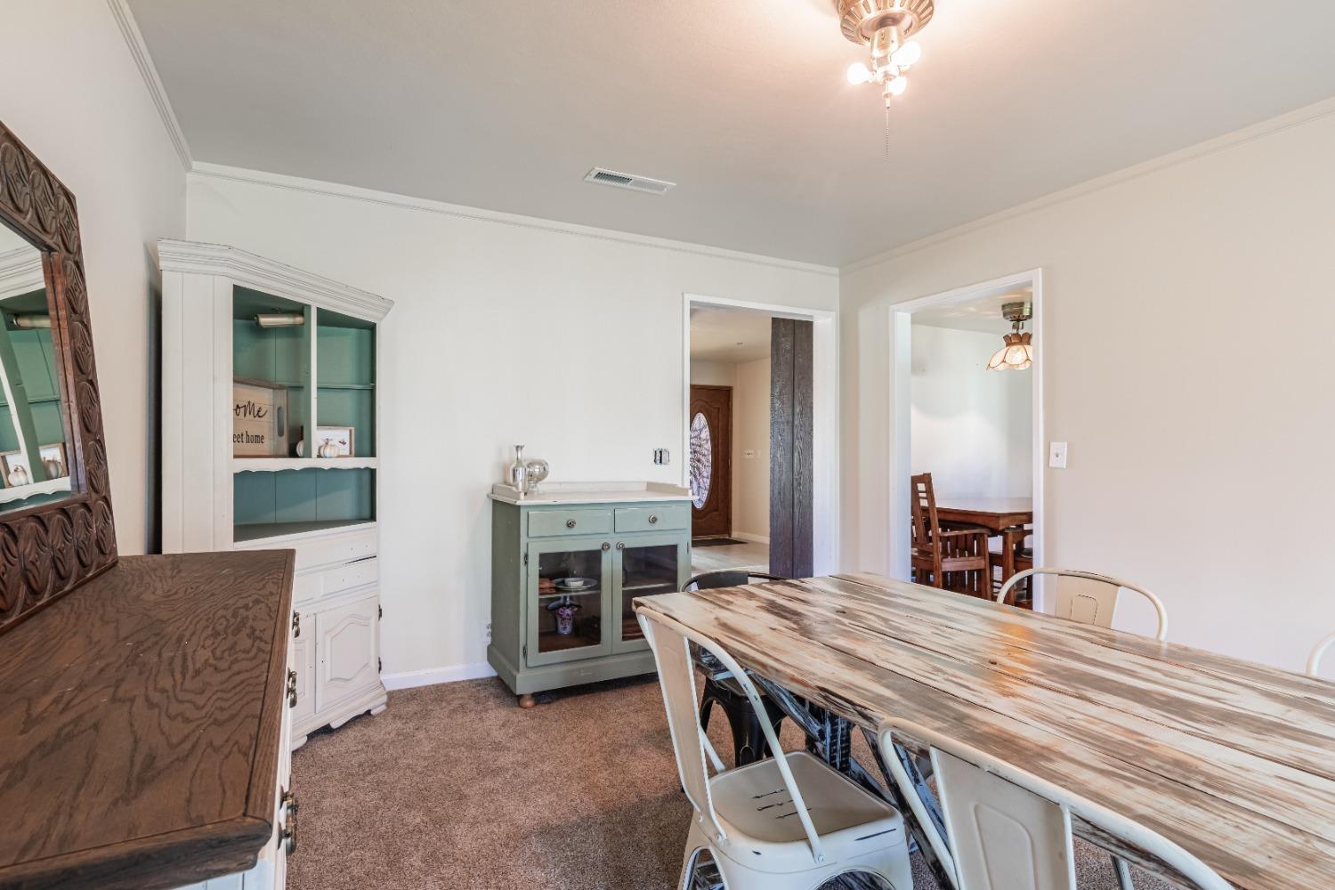16993 Jennifer Court Madera, CA 93636 - Photo 6 of 55 a living room with furniture and a fireplace