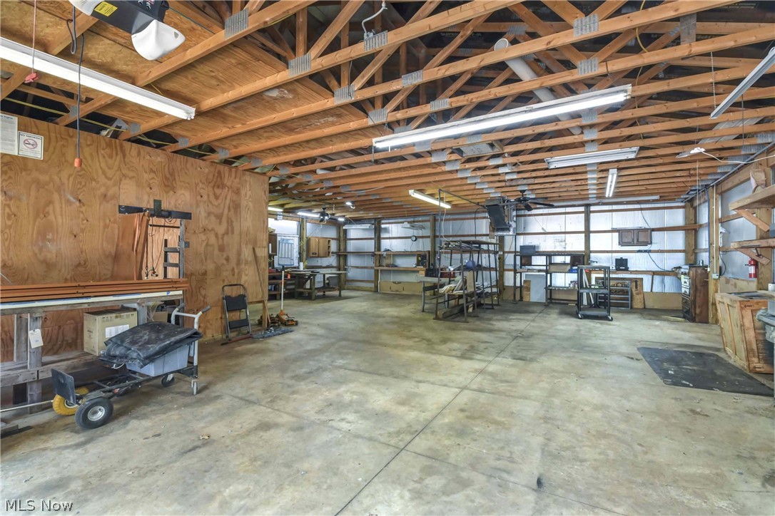 301 Crosse Road Amherst, OH 44001 - Photo 39 of 49 Interior of the main part of the outbuilding which can be used as a two car garage in the front and then a workshop int he back.