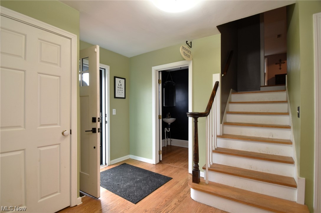 149 North Medina Line Road Akron, OH 44333 - Photo 4 of 36 Entryway featuring light hardwood. Half bath is tucked in entryway.