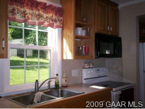 262 Cider Mill Road Mount Sidney, VA 24467 - Photo 2 of 9 a kitchen with a sink a counter top space and cabinets