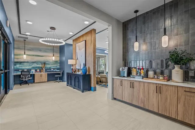 a open kitchen with cabinets a sink and wooden floor