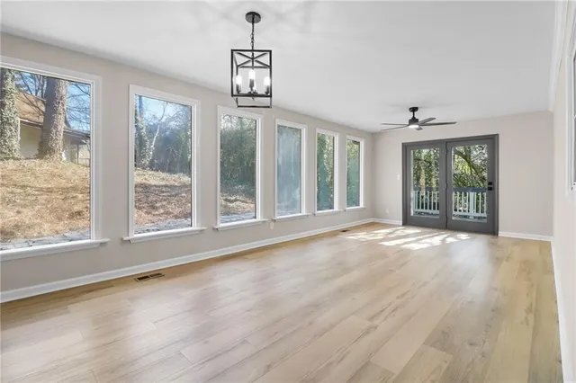 a view of an empty room with a window