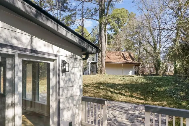 a view of a house with a large tree