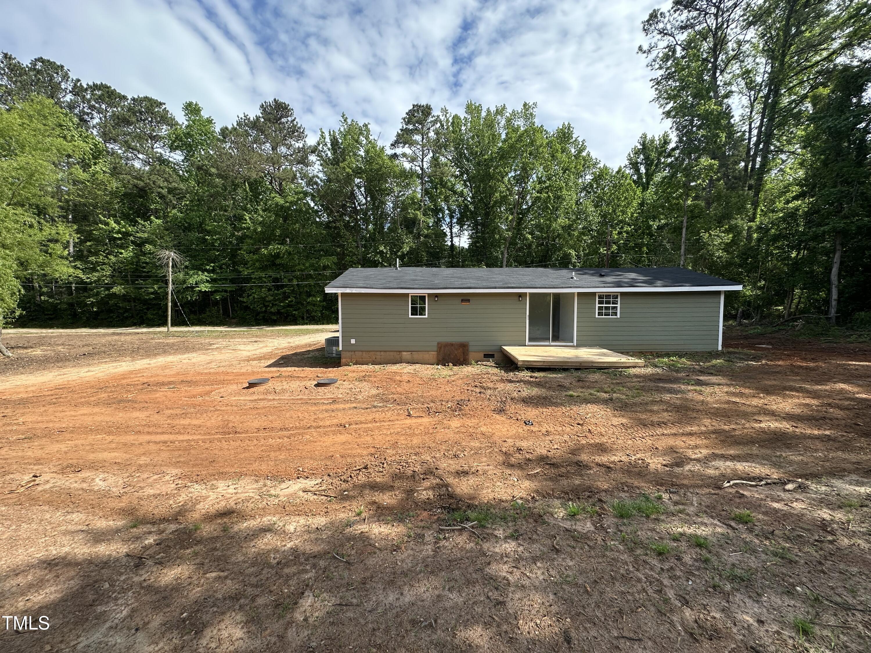 8505 Ray Road Raleigh, NC 27613 - Photo 2 of 15 a backyard of a house with table and chairs