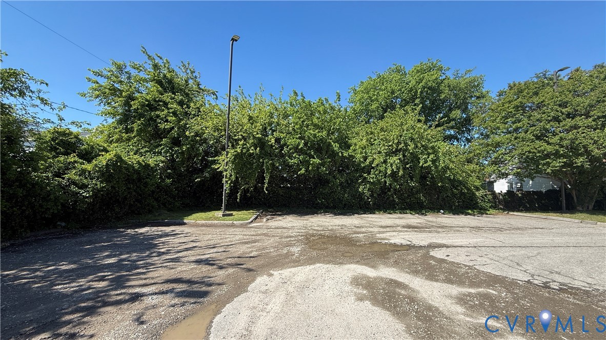19 Tennis Lane Hampton, VA 23663 - Photo 2 of 2 Expansive paved lot with established perimeter tre
