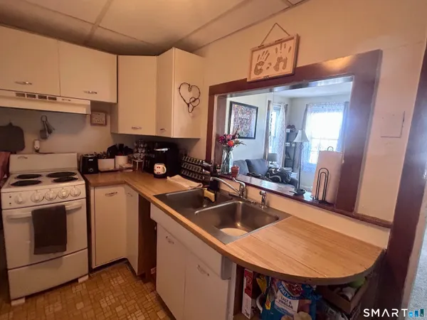 a kitchen that has a sink and a stove