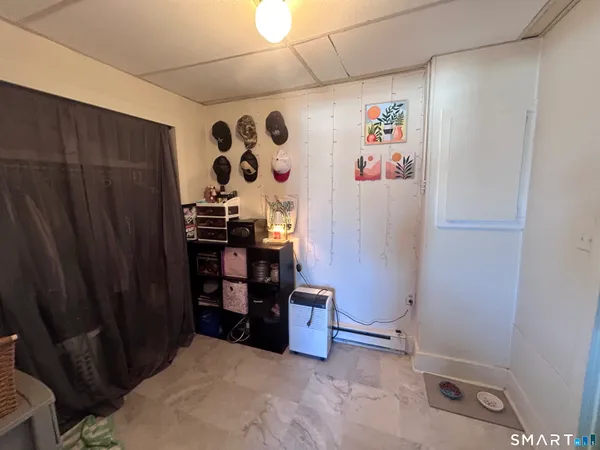 a view of storage and utility room with racks on the wall