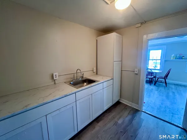 a kitchen with sink and cabinets
