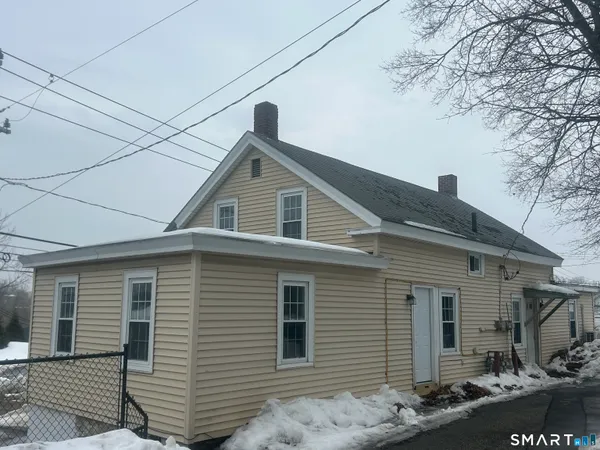 a front view of a house with garage