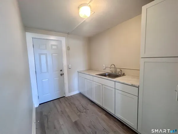 a view of a kitchen from the hallway