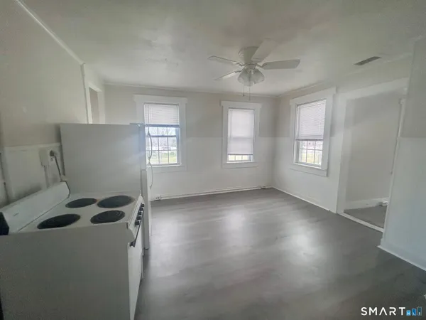 a view of workspace with window and ceiling fan