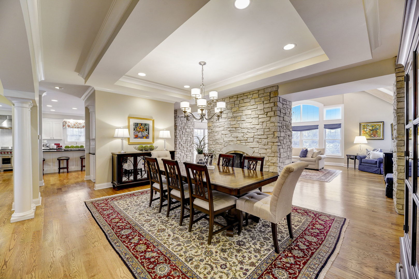 20940 West Summit Drive Kildeer, IL 60047 - Photo 20 of 62 a dining room with furniture a rug and a chandelier