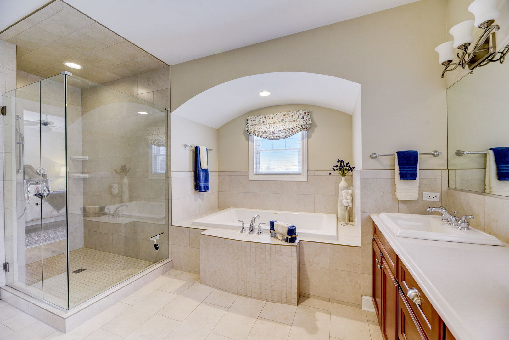 20940 West Summit Drive Kildeer, IL 60047 - Photo 23 of 62 a bathroom with a tub sink mirror and shower