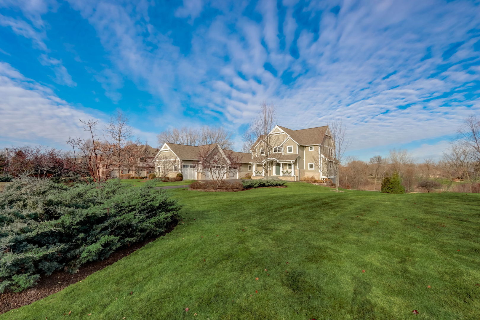 20940 West Summit Drive Kildeer, IL 60047 - Photo 3 of 62 a view of a big house with a big yard and large trees