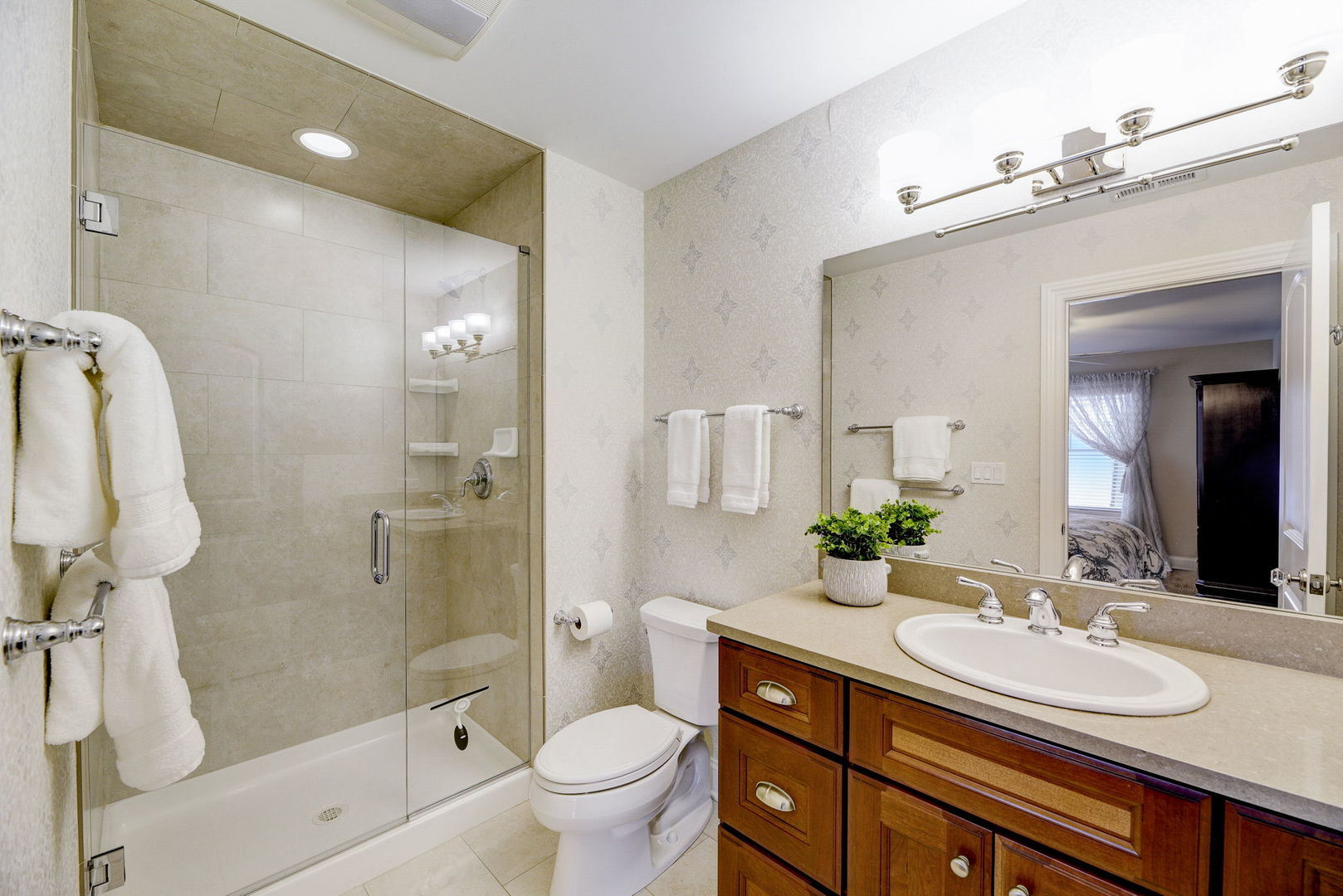 20940 West Summit Drive Kildeer, IL 60047 - Photo 33 of 62 a bathroom with a granite countertop sink a toilet a mirror and shower