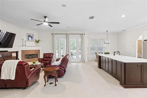 a living room with furniture fireplace and a flat screen tv