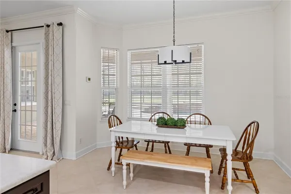 a view of a dining room that has a table and chairs