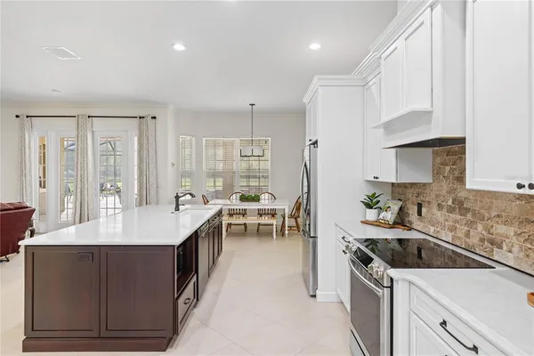 a kitchen with a sink stove and cabinets
