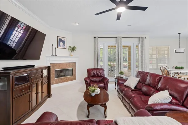 a living room with furniture fireplace and flat screen tv