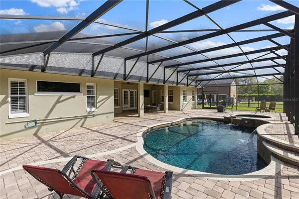 a view of a swimming pool with a patio