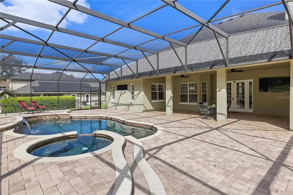 a view of a swimming pool with a patio