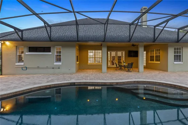 a kitchen with stainless steel appliances granite countertop a sink a counter space and wooden cabinets
