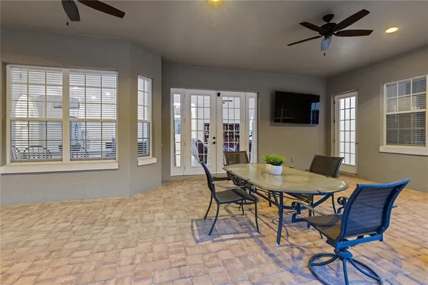 a dining room with furniture and window