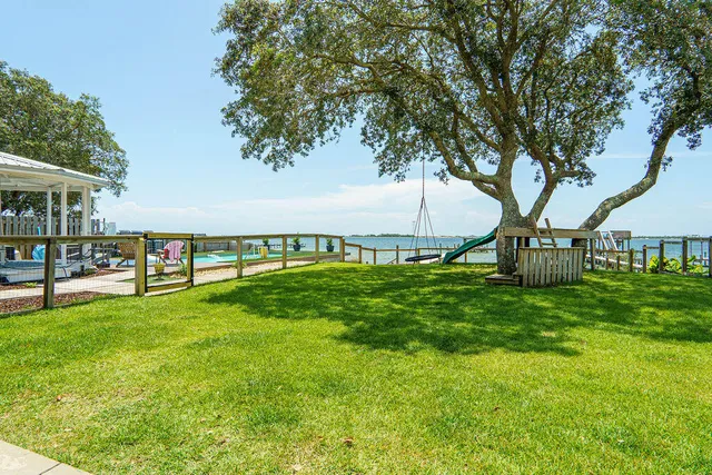 a bedroom with a bed and a mirror