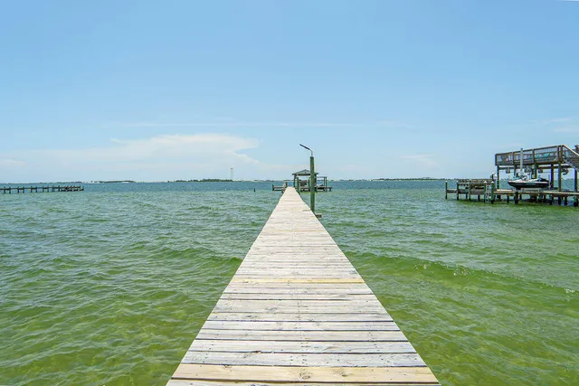 a bedroom with bed and a window