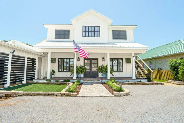 a view of house with outdoor space and porch