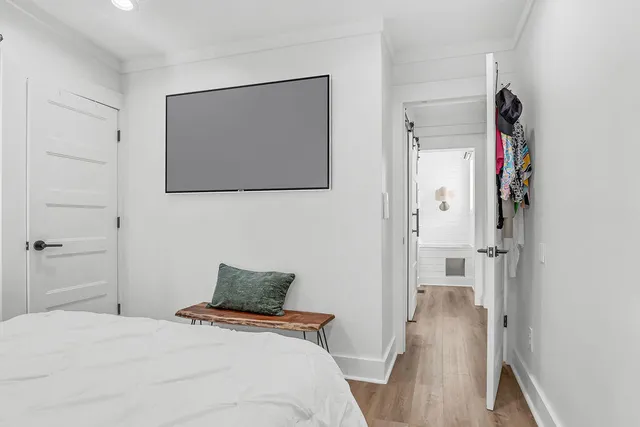a en suite bathroom with a granite countertop sink and a mirror